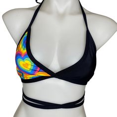 Handsewn triangle top that comes in our POSITIVE VIBRATIONS fabric. This top is half rainbow vibrations, half black. SIZE CHART available in photos please read all shop policies before purchasing this item Fitted Cross-tied T-back Swimwear, Black Adjustable Triangle Halter Top, Fitted Cross-tied Swimwear With Strappy Back, Stretch Halter Tie Back Triangle Top, Stretch Triangle Halter Top With Tie Back, Fitted Strappy Cross-tied Swimwear, Fitted Strappy Halter Top For Festivals, Fitted Cross-tied Strappy Swimwear, Multicolor Fitted Swimwear With Tie Back