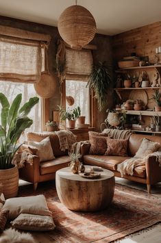 a living room filled with lots of furniture and plants