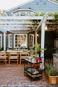 an outdoor dining area with tables and chairs