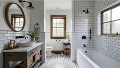 a bathroom with two sinks and a bathtub next to a window in the wall