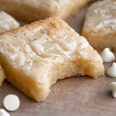 several pieces of cake with marshmallows scattered around them