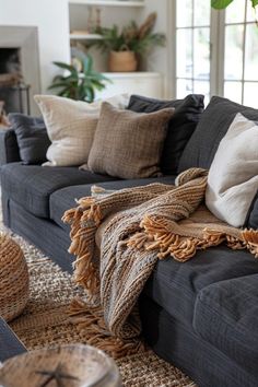 a living room filled with furniture and pillows