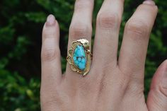 Vintage 14k gold and turquoise Navajo ring by the maker Ivan V. Era: c.1970s Markings: IVAN V 14k Materials: 14k gold, turquoise Ring Size: 7 1/4 (Comes with one free resizing by our jeweler) Face measures 2 3/4 cm in length Weight: 6.5 grams Condition: Excellent vintage condition with minor surface wear from age  Shipping is free in the United States Follow us on Instagram @LUXXORVintage Artisan Gold Turquoise Ring, Handmade Gold Turquoise Ring, Unique Handmade Gold Turquoise Ring, Bohemian Turquoise Ring With Inlay For Anniversary, Bohemian Turquoise Inlay Ring For Anniversary, Handmade Gold Bohemian Turquoise Ring, Handmade Bohemian Gold Turquoise Ring, Vintage Turquoise Ring In 14k Gold, Vintage 14k Gold Turquoise Ring