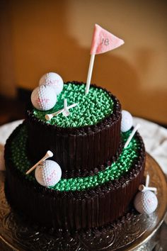 a three tiered cake decorated with golf balls and tees