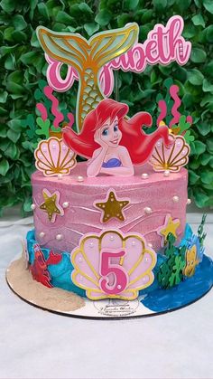 a little mermaid cake with the name ariel on it