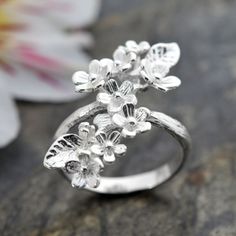 Our eye catching Forget Me Not Cluster Ring makes an unforgettable gift. A perfectly pretty cluster of flowers set on a stunning silver ring. A charming and sweet gift, one that exudes love and friendship without the obvious heart symbolism. Whether its a gift for a spring bride, friend on her travels or a little treat just for you it is sure to bring a smile to any woman's face. This Sterling Silver Forget Me Not Cluster Jewellery is delicately designed to symbolise the close bonds of love, friendship and family. A pretty present for that someone special evoking memories of you every time they are adorned with this adorable accessory. With its adjustable design this ring can be gently squeezed to make it shrink or stretch accommodating a range of finger sizes. Make sure this one size fits Love And Friendship, Gold Earrings Designs, Silver Jewelry Handmade, Bling Rings, Girly Jewelry, Brown Floral, Forget Me Not, Jewelry Inspo, Silver Flowers