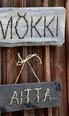 a wooden sign with the word atta written on it