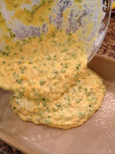 the batter is being mixed in with the other ingredients to make an appetizer