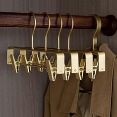 a coat rack with clothes hanging on it