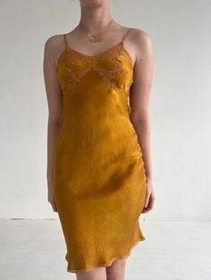 Please note that this item is final sale and cannot be returned or exchanged. See more in our Shipping and Returns page. Originally from the 1930s. This vintage dress is hand dyed by Eveliina Vintage. Beautiful silk spaghetti strap slip dress. Features lace detailing on the bust. Contents 100% Silk Excellent Condition Care Dry clean only Dimensions Bust: 32" Waist: 28" Hip Width: 42" This is a previously loved vintage garment, and therefore supports the planet by promoting a circular system carrying a lighter carbon footprint. Fitted Bias Cut Slip Dress, Vintage Fitted V-neck Slip Dress, Vintage V-neck Evening Slip Dress, Fitted Sleeveless Silk Dress For Daywear, Daywear Fitted Silk Slip Dress, Vintage Knee-length Dress For Date Night, Silk Fitted Slip Dress For Daywear, Fitted V-neck Silk Dress For Daywear, Fitted Midi Slip Dress For Daywear