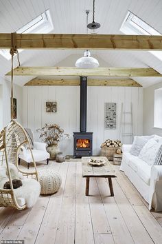 a living room filled with furniture and a fire place