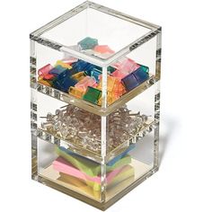 a clear box filled with lots of different colored objects