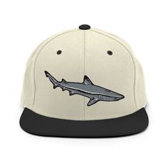 "Reef Shark Snapback Hat, Shark Embroidery, Reef Black tip Shark, Coral Life Hat, Reef Shark, Divers gift, Diving Design, Reef Souvenir  Plum & Pepper Reef Shark Design. \"Sideview of a hunting black tip grey reef shark\" Our Snapback Hat is made from a premium wool blend with a flat visor. All Colour options hide a vivid accent--a green undervisor and a funky Plum & Pepper Embroidery Design. * 80% acrylic, 20% wool* Soft, unstructured crown, curved visor * Structured, 6-panel, high-profile * 6 Adjustable Flat Bill Hat With Custom Embroidery, Custom Embroidered Adjustable Flat Bill Baseball Cap, Black Baseball Cap With Custom Embroidery, Adjustable Flat Bill Baseball Cap With Custom Embroidery, Embroidered Flat Bill Fitted Hat, Custom Embroidered Adjustable Snapback Hat, Black Cap With Custom Embroidery, Embroidered Black Hats As Gifts, Pepper Embroidery