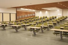 an empty classroom with desks and chairs