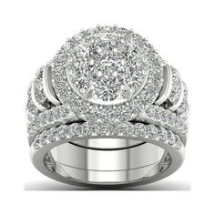 a white gold ring with two rows of diamonds on the band and an oval shaped center stone