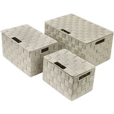 four white baskets are stacked on top of each other