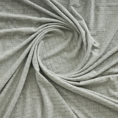 a close up shot of the fabric on a bed sheet that has been made with grey linen