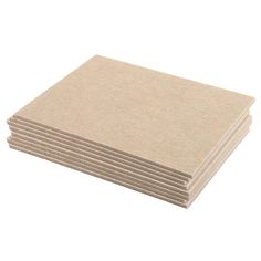 several pieces of brown paper stacked on top of each other in front of a white background