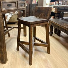 a wooden chair sitting on top of a hard wood floor