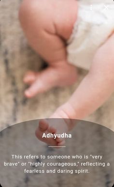 a baby holding its hand up to the camera with an ad for adlyudha