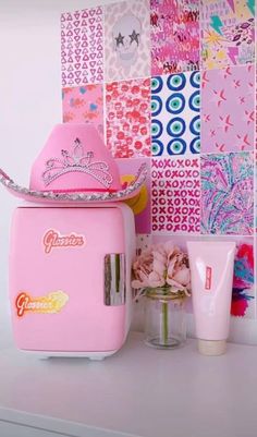 a pink ice cream machine sitting on top of a counter