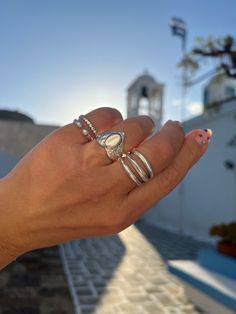 Introducing our stunning collection of silver rings, designed and handmade by the skilled artisans of Christina Christi in Greece. Each ring is crafted from basic metal, giving it a sleek and modern look that is perfect for any occasion. Each of our rings is handcrafted with a passion for quality and excellence, and is only available in our store, Christina Christi. We take pride in our designs and the attention to detail that goes into each piece. Make a statement with our versatile silver ring Silver Sterling Silver Pearl Ring With Polished Finish, Sterling Silver Open Pearl Ring With Polished Finish, Handmade Sterling Silver Signet Ring, Artisan Sterling Silver Open Ring Jewelry, Artisan White Ring For Wedding, Silver Heart-shaped Open Ring Fine Jewelry, Silver Stackable Dome Ring For Wedding, Bohemian Silver Rings With Polished Finish, Silver Stackable Dome Ring For Promise