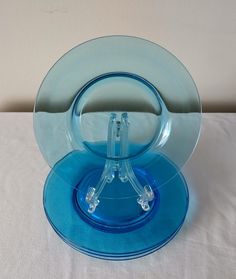 a blue glass plate sitting on top of a white table