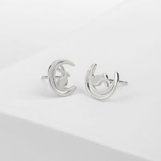 Made with genuine 925 Sterling Silver Nickel-free and lead-free Hypoallergenic and antimicrobial Boma 925 hallmark is located on the earring post Code: ES 5218 Dimensions: approx. 1/8" depth x 3/8" width x 3/8" height Adorable Bunny and the Moon Earring Studs Whether you're looking for a unique pair of everyday earrings or something extra special to layer with your favorite pieces, our moon bunny stud earrings are perfect to complete your look and complement your personality. These moon bunny st Moon-shaped White Jewelry With Matching Earrings, White Moon-shaped Jewelry With Matching Earrings, Metal Moon-shaped Jewelry With Matching Earrings, Nickel-free Moon-shaped Metal Earrings, Moon Bunny, Moon Earrings Studs, Adjustable Moon-shaped Sterling Silver Earrings, Moon Earring, Jewelry Recycled