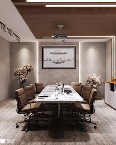 an empty conference room with chairs and a table in front of a large painting on the wall