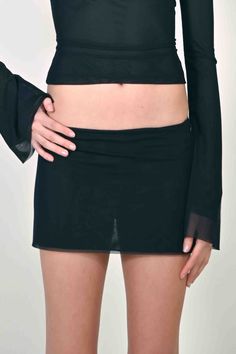 PREORDER: PLEASE ALLOW 2-3 MONTHS TO RECIEVE YOUR ITEM The Jane Micro Mini Skirt in Black Mesh is one of the newest additions to our Jane Collection. She features a double lined mesh with a micro mini length. Inspired by the 90's and 2000's she's the perfect skirt to style with the Jane Top or wear on its own. Stretchy and fitted Double lined mesh fabric Sizing Model is 5'9 and wearing size SMALL. Runs true to size. Care Machine wash cold. 100% Polyester (96% Polyester 4% Elastane) Micro Mini Skirt, Micro Mini, Guinea Bissau, Equatorial Guinea, British Indian, Mozambique, Black Mesh, Brunei, Caribbean Netherlands