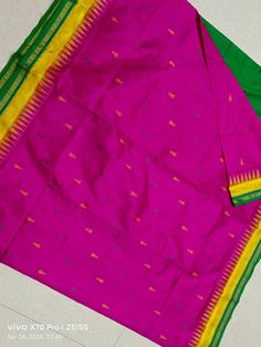 Introducing our exquisite Pink Odisha Sambalpuri Half Tissue Silk Pure Handloom saree, a masterpiece of elegance and tradition. Handcrafted with precision by skilled artisans, this saree exudes timeless beauty and cultural richness. The delicate pink hue symbolizes grace, femininity, and romance, reflecting the essence of a woman's inner strength and charm. Paired with a vibrant green temple border and adorned with intricate floral conch motifs on the pallu, this saree celebrates the beauty of n Pink Paithani Silk Traditional Wear With Patterns, Pink Paithani Silk Traditional Wear With Traditional Patterns, Pink Traditional Wear With Paithani Silk And Traditional Patterns, Pink Paithani Silk Traditional Wear With Motifs, Multicolor Woven Motifs Saree For Eid, Pink Paithani Silk Blouse With Traditional Patterns, Festive Purple Saree With Woven Motifs, Traditional Purple Wear With Woven Motifs, Pink Saree With Woven Motifs For Traditional Ceremonies