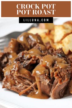 crock pot roast on a white plate with potatoes and gravy