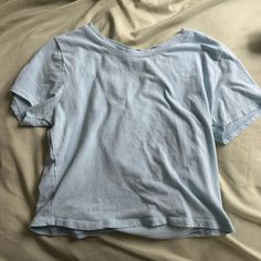 Never Worn In Great Condition. Size Medium But Fit Large Trendy Blue Cotton Shirt, Light Blue Cotton T-shirt For Spring, Summer Light Blue Crew Neck Top, Light Blue Crew Neck Top For Summer, Blue Relaxed Fit Cotton Top, Casual Washed Blue Top For Spring, Basic Blue Summer Tops, Basic Blue Tops For Summer, Trendy Light Blue Cotton Tops