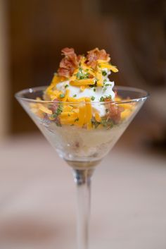 a small glass filled with food on top of a table