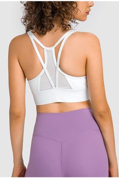 Pattern: Solid Features: Longline. mesh panel in back. removable padding. racerback Neckline: Scoop neck Product measurements: 4: length 13 in. bust 27 in. hem width 23 in6: length 13 in. bust 28 in. hem width 25 in8: length 13 in. bust 30 in. hem width 27 in10: length 14 in. bust 31 in. hem width 28 in12: length 14 in. bust 33 in. hem width 30 in Material composition: 80% nylon. 20% spandex Care: Machine wash cold. Tumble dry low. Imported Mesh Sports Bra With Built-in Padding For Yoga, Mesh Sports Bra With Built-in Bra For Light Exercise, Mesh Sports Bra With Built-in Padding For Gym, Mesh Racerback Activewear With Built-in Bra, Nylon Racerback Sports Bra With Built-in Bra, Fitted Sleeveless Mesh Sports Bra, Training Activewear With Mesh And Strappy Back, High Stretch Racerback Tank Top With Mesh Back, High Stretch Mesh Back Racerback Tank Top