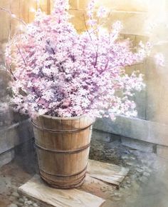 a bucket filled with lots of purple flowers