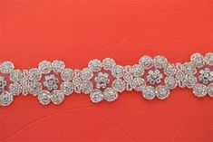 This beautiful trim is made of high-quality clear rhinestones. It is perfect for all special occasions. It can be used for wedding dress, wedding belts and sashes, bridesmaid sashes and belts hats, headbands, headpieces, flower bouquet wrap, wedding invitation, gowns, hair accessory, sash craft, jewelry, cake decoration, bags, scrapbook or any other decorations. Applying Method: Sew on, Glue on Color: SIlver Gold Size: Width: 1 1/2Inches approx. Length: 36: inches Please contact us for wholesale Wedding Belts And Sashes, Gown Belt, Jewelry Cake, Bridesmaid Sash, Wedding Sash Belt, Bouquet Wrap, Rhinestone Chain, Wedding Sash, Craft Jewelry