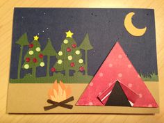 this is an image of a campfire and tent made out of construction paper on a table