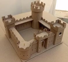 a castle made out of cardboard sitting on top of a table