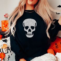 "Skull Sweatshirt, Glitter Skull Sweatshirt, Skull Sweater, Spooky Sweatshirt, Halloween Sweatshirt, Skeleton Sweatshirt, Skull Shirt, Gothic Our spooky Halloween skull sweatshirt makes the perfect addition to your wardrobe this Halloween. The bats are made of a high quality black or silver glitter that won't fall off or leave glitter anywhere, not even after washing. If you have any questions feel free to reach out and I am happy to help. PLEASE NOTE: THIS SWEATSHIRT IS A UNISEX FIT SO IT DOES Black Skull Sweatshirt For Halloween, Black Halloween Skull Sweatshirt, Black Halloween Sweatshirt With Skull, Halloween Skull Sweatshirt In Black, Halloween Skull Print Crew Neck Sweatshirt, Halloween Skull Print Crew Neck Sweater, Halloween Crew Neck Sweater With Skull Print, Glitter Skull, Washing And Drying Machine