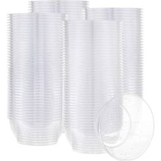 a stack of clear plastic cups on a white background with the lid removed from each cup