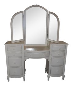 a white dresser with mirror and drawers on it's sides, against a white background