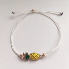 This item is ready to ship! Customization is NOT available for this listing. If you would like something custom, please send me a message! This pineapple wax cord bracelet is the perfect gift for the fruit lover in your life. It also happens to be a symbol for those going through infertility, and would be a great gift for those loved ones as well! Completely waterproof, adjustable so it will fit any size wrist. Just pull to close. All of my friendship bracelets are made with 100% cotton embroide Gold Friendship Bracelets With Sliding Knot For Summer, Resizable Gold Friendship Bracelets For Summer, Gold Bracelets With Sliding Knot For Summer, White Summer Jewelry For Friendship, Summer Gold Braided Bracelet With Sliding Knot, Summer Friendship Gold Bracelets, Gold Bracelets For Friendship And Summer, Gold Bracelets For Friendship In Summer, White Friendship Bracelet With Sliding Knot For Summer