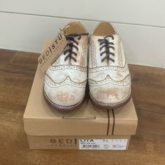 Brand New Condition With Box Women’s Size 7.5 Distressed/ Rustic Style White Lace-up Shoes With Brogue Detailing, White Flat Heel Oxfords With Brogue Detailing, White Brogue Oxfords With Flat Heel, White Brogue Oxford Shoes With Flat Heel, White Closed Toe Lace-up Shoes With Rubber Sole, White Brogue Lace-up Shoes With Round Toe, White Lace-up Shoes With Almond Toe And Rubber Sole, Casual White Almond Toe Lace-up Shoes, Casual White Lace-up Shoes With Brogue Detailing