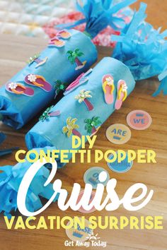 some blue paper rolls are sitting on a table with the words diy confetti popper cruise vacation surprise