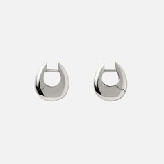 The Annika Inez Sloping Hinge Hoop Earrings, Small are organic, sculptural hoop earrings featuring a hinge snap closure designed to be a part of your regular rotation. 925 Sterling Silver (92.5% silver / 7.5% copper) is the strongest alloy that balances beauty and durability. Length: 0.5” / 1.3cm Handcrafted in New York City Modern Pierced Huggie Earrings, Modern Small Hoop Pierced Earrings, Modern Hinged Earrings As Gifts, Modern Hinged Earrings For Gift, Modern Small Hoop Huggie Earrings For Pierced Ears, Modern Teardrop Huggie Earrings With Polished Finish, Modern Small Hoop Huggie Earrings, Modern Huggie Hoop Earrings, Modern Metal Pierced Huggie Earrings