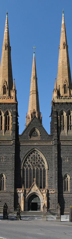 an old church with three steeples and a clock tower