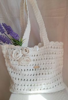 Handbag knitted from strong polyester cords. Both sides are knitted equally. Cream Knitted Summer Bag, Cream Knitted Bag For Summer, Rectangular White Crochet Bag For Vacation, White Rectangular Shoulder Bag With Braided Handles, Elegant White Straw Tote Bag, White Crochet Travel Bag With Braided Handles, Cream Knitted Crochet Tote Bag, White Crochet Bag With Braided Handles For Travel, White Knitted Tote Shoulder Bag