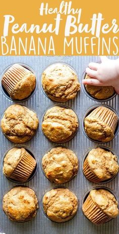 a pan filled with banana muffins on top of a baking sheet next to a hand