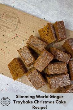 a cutting board topped with brownies covered in powdered sugar and sprinkles